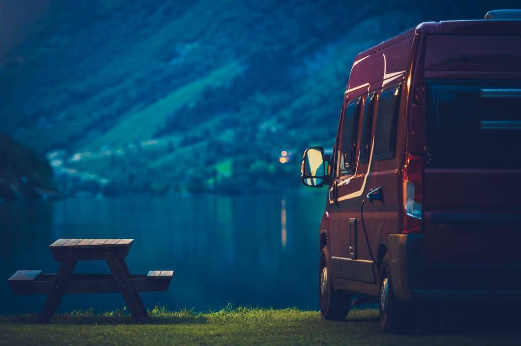 RV Camping at Night. Small Camper Van Overnight Camping.